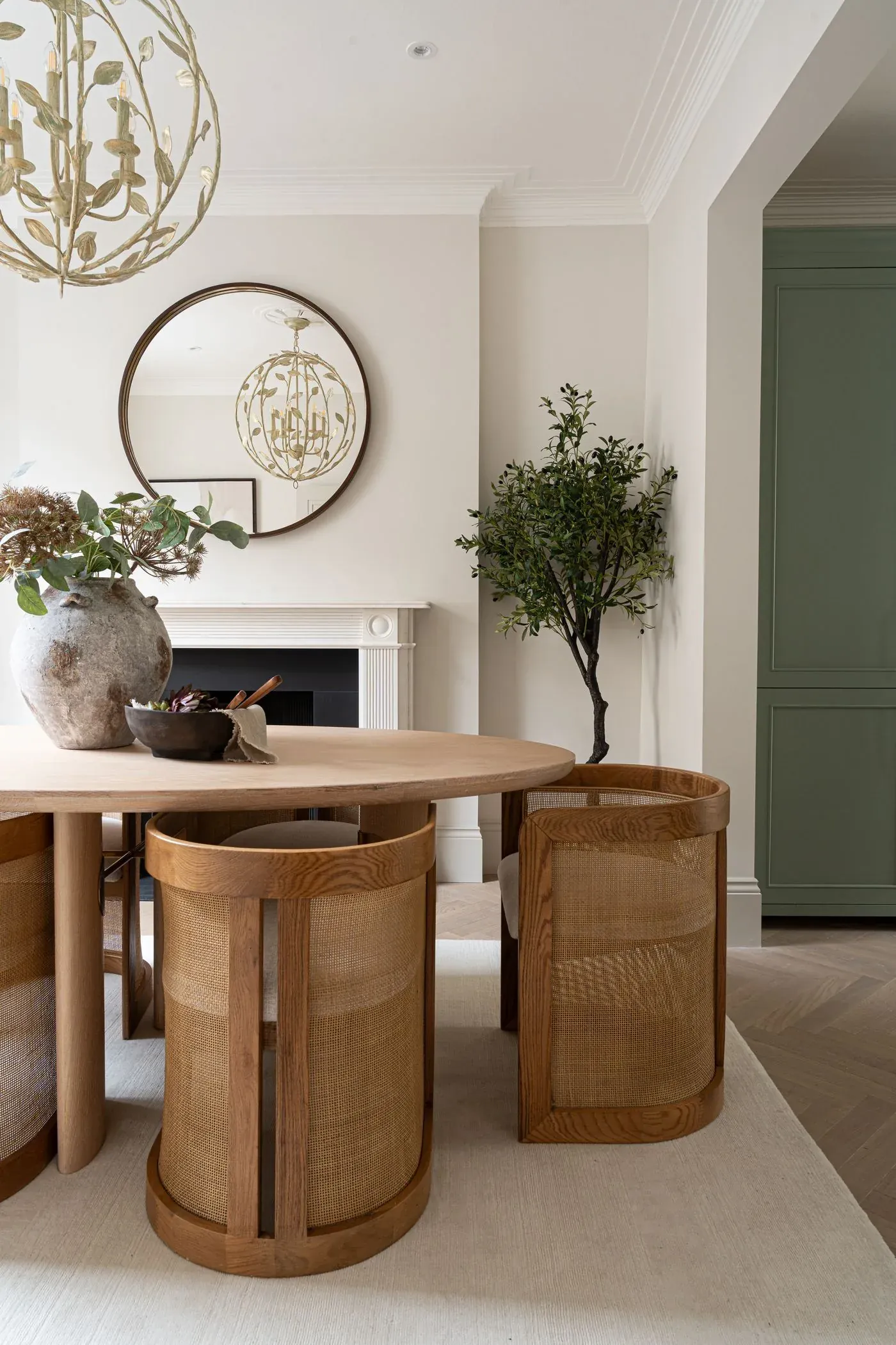 Dining room with restored cornicing, marble fireplace and oak dining table