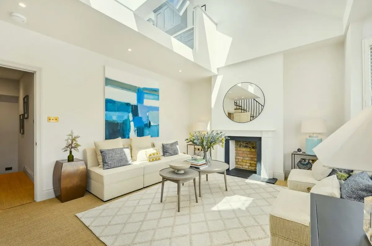 Harbord Street reception room opened up to the galleried kitchen above