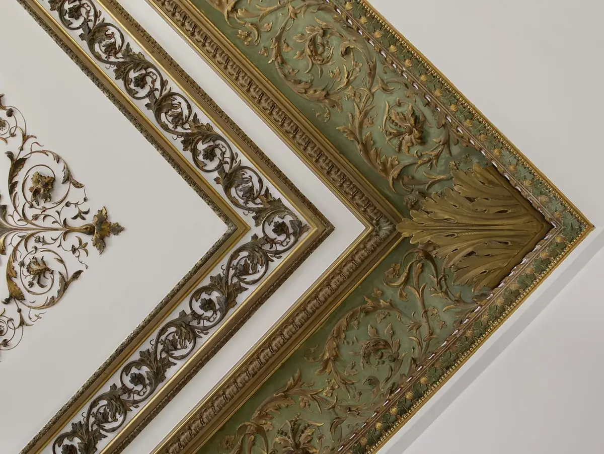 Restored gilded plaster ceiling with acanthus leaf and scrolling foliage mouldings